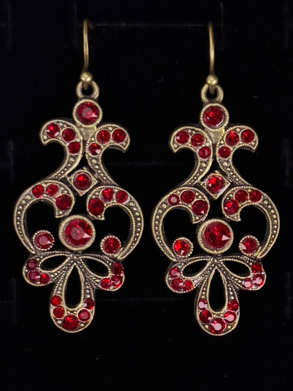 Vintage aged brass tone, red bling chandelier costume pierced earrings
